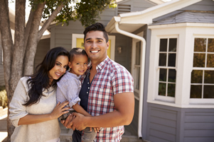 Family in Front of House